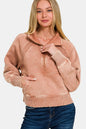 Woman wearing a Zenana acid washed half zip fleece sweatshirt with kangaroo pocket and ribbed cuffs in light brown color