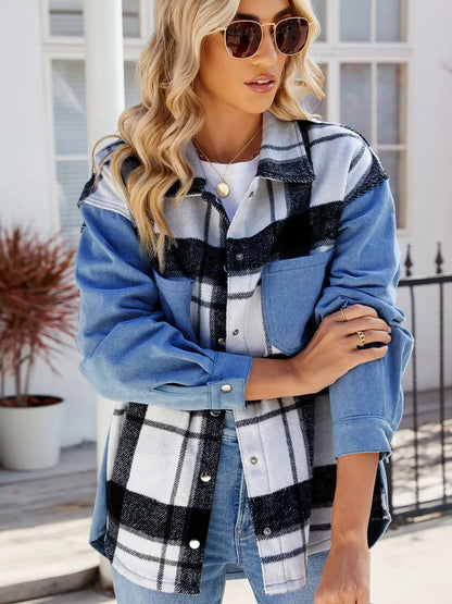 Woman wearing pocketed plaid snap down denim jacket with blue sleeves and black white check pattern outdoors
